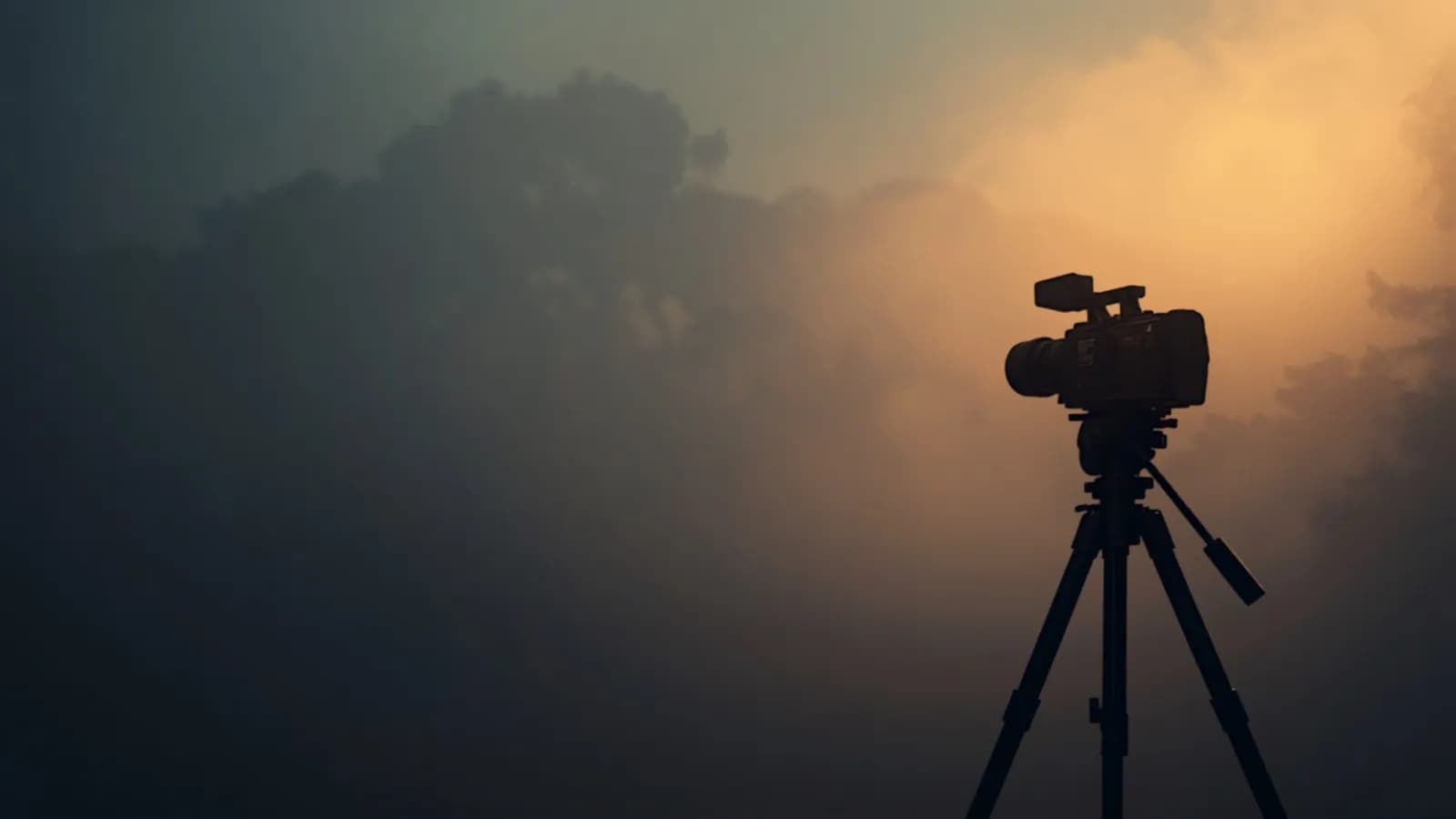 A film set with a cinema camera at golden hour